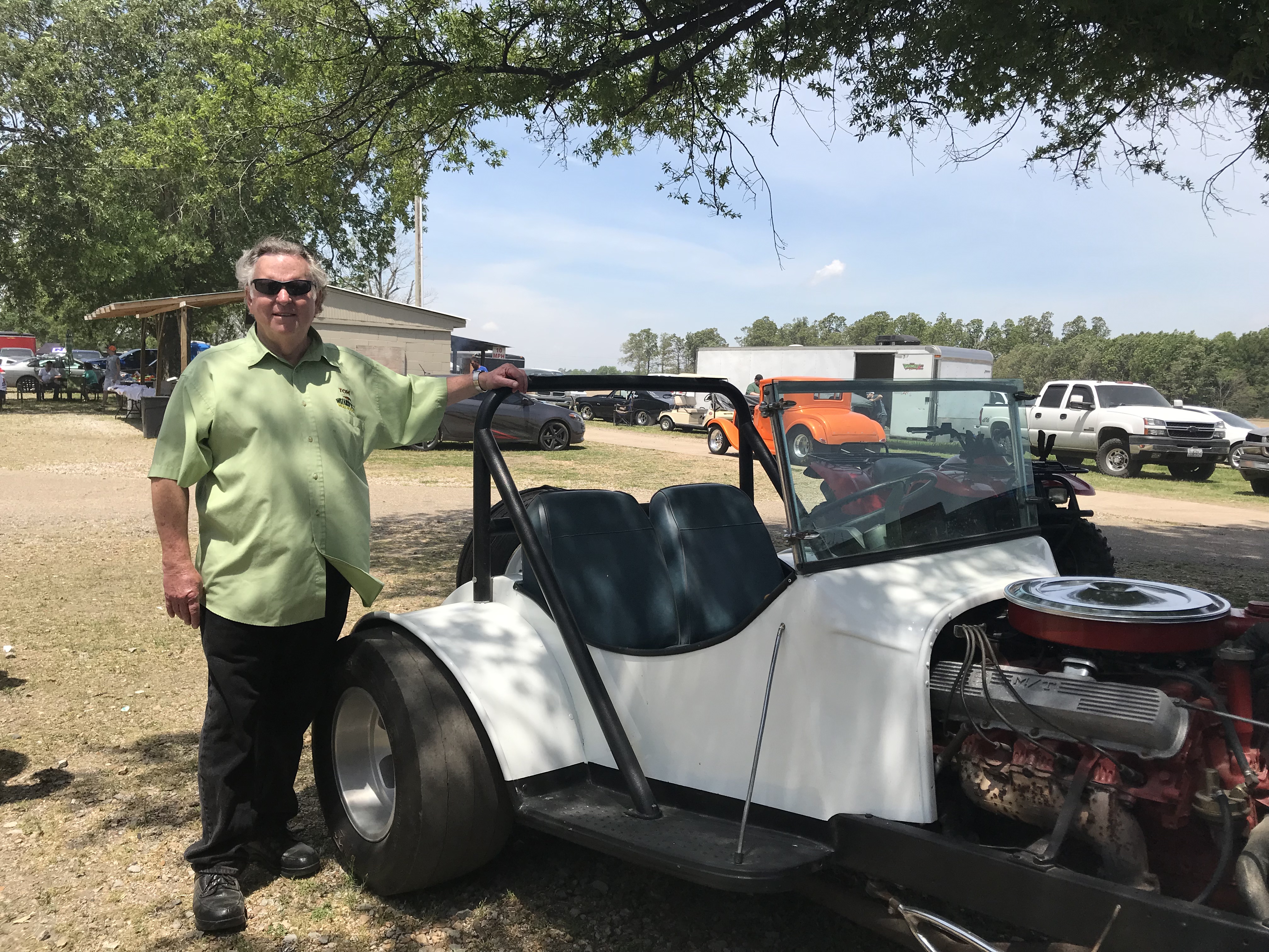 Tom standing near George Ray's roadster
