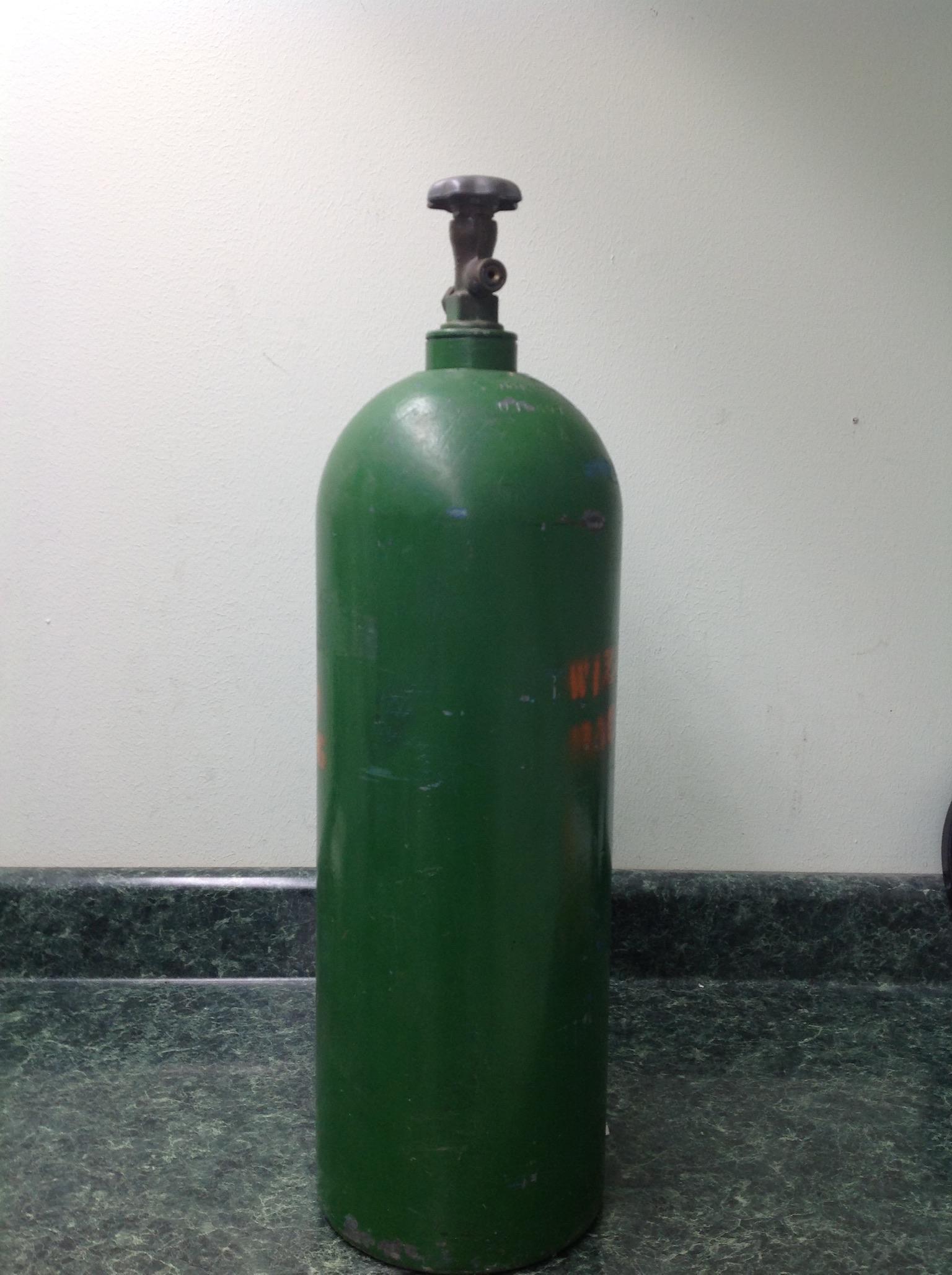 tall air bottle, color green, used.