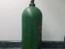 tall air bottle, color green, used.