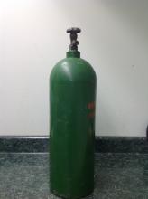 tall air bottle, color green, used.